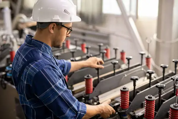 Factory worker performing assembly line tasks